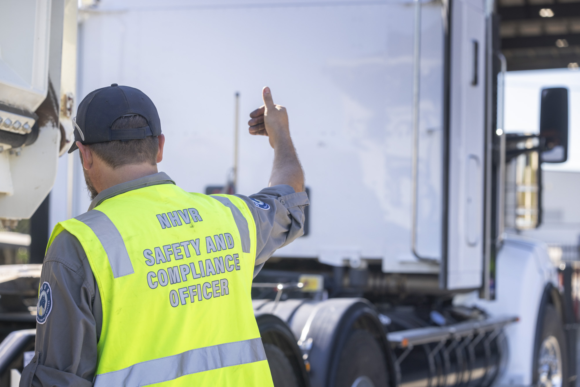 NHVR Safety and Compliance Officer conducting heavy-vehicle compliance activity in Queensland