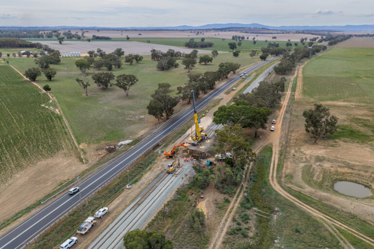 Track construction machinery working beside freight rail lines between Junee and Illabo