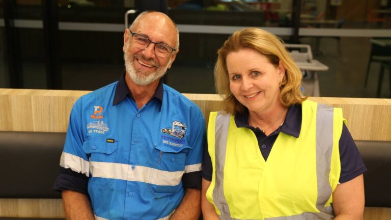 Nicole Rosie and Rod Hannifey seated at BP Heathwood after the B-double trip from Dubbo to Brisbane.