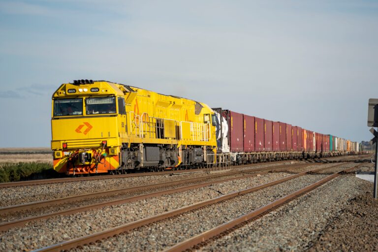 Aurizon intermodal freight train hauling containers through Wallan, Victoria.